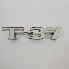 Load image into Gallery viewer, 71 1971 Pontiac Lemans Tempest T-37 Trunk Emblem GM 683946 NOS T37