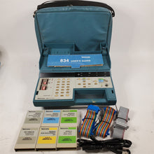 Load image into Gallery viewer, Tektronix 834 Programmable Data Communications Tester w/ 6 Rom Packs &amp; 2 Cables