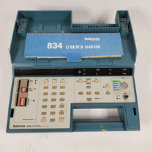 Load image into Gallery viewer, Tektronix 834 Programmable Data Communications Tester w/ 6 Rom Packs &amp; 2 Cables